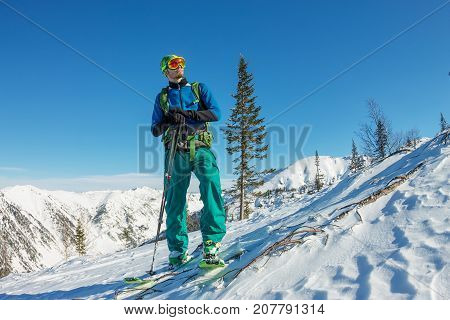 Man Skier Freerider Standing At Top Of Ridge, Adventure Winter Freeride Extreme Sport