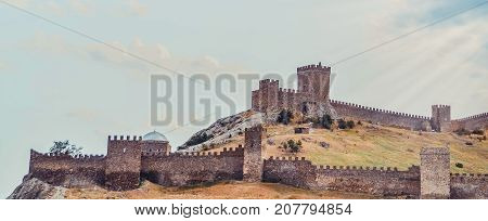 Genoese fortress in Sudak, the Crimea Peninsula, Black sea. Consular castle and the fortification wall of the upper tier. Part of the wall, Museum-reserve 