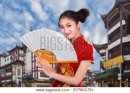 Chiness lady in cheongsam dress with Shanghai vintage building and street Shang hai city China