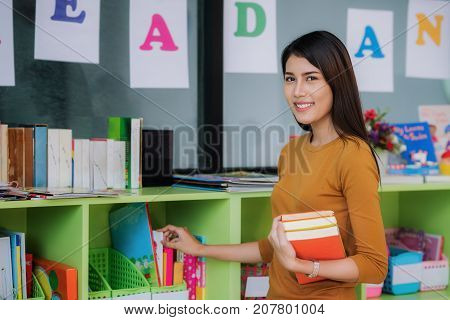 Teacher prepare book for teach student in preschool education job occupation concept