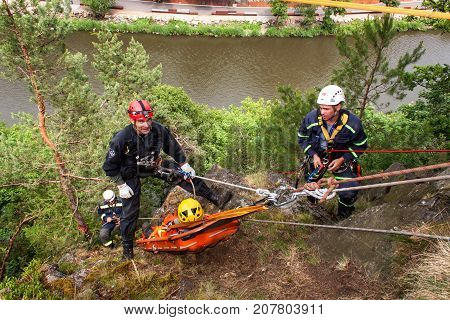 Kadan Czech Republic June 6 2012: Exercise rescue units. Training rescue people in inaccessible terrain at the dam Kadan. Recovery using rope techniques