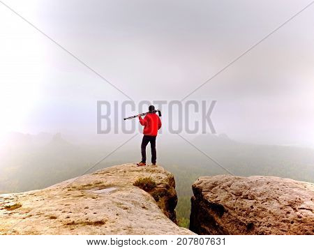 Nature Photographer Prepare Camera To Takes Impressive Photos Of Misty Fall Mountains. Tourist Photo