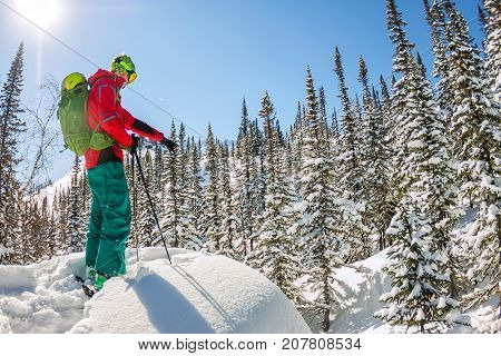 Man Standing At Top Of Ridge. Ski Touring In Mountains. Adventure Winter Freeride Extreme Sport