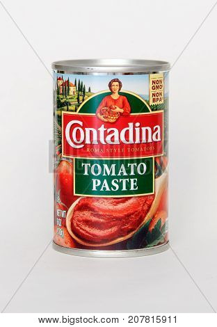 New York September 17 2017: Can of Contadina tomato paste stands against white background.