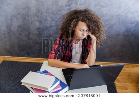 Unhappy Teenage Girl Using Laptop At H Ome