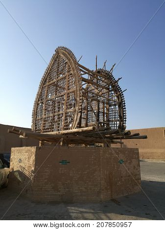 Old wooden procession figure tomb in Iran