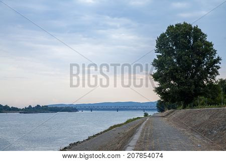 Pancevo Bridge (Pancevacki Most) in Belgrade Serbia seen from far away on the Danube Quays. The bridge is the oldest bridge of the capital city of Serbia crossing the river Danube