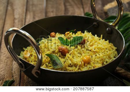 South Indian Curry leaves rice / Karuvepilai sadam served in a Kadai