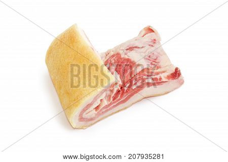 Piece of salted streaky pork belly with skin on a white background