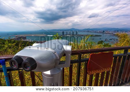 Binoculars for viewing the panorama of the city. Sanya Phoenix Island President Resort Apartment, Hainan Sheng, Sanya Shi, Tianya Qu, China. Picture was taken from Luhuitou Peak Park.