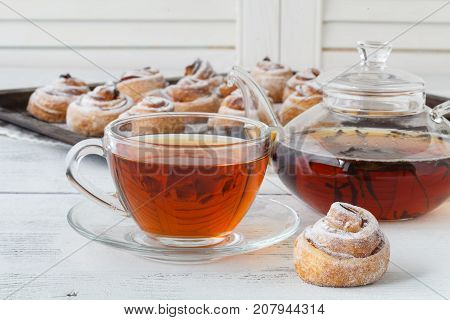 Cup Of Tea And Small Apple Roses Shaped Pies. Sweet Apple Dessert Pie. Homemade Apple Rose Pastry. B