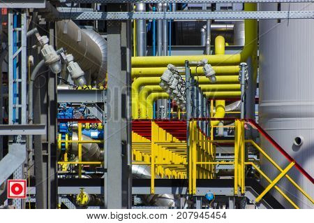 The different colored pipes in the installation of a petrochemical plant
