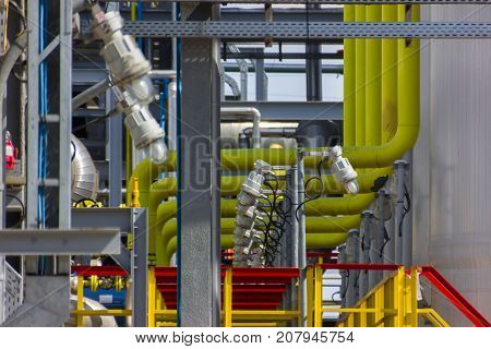 The different colored pipes in the installation of a petrochemical plant