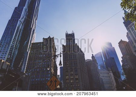 NEW YORK NEW YORK - September 4th 2017: Architecture and beautiful buildings along the streets of Manhattan New York in the City Hall area near Brooklyn Bridge on a sunny late summer day