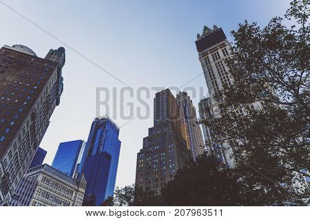 NEW YORK NEW YORK - September 4th 2017: Architecture and beautiful buildings along the streets of Manhattan New York in the City Hall area near Brooklyn Bridge on a sunny late summer day