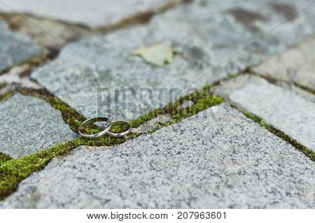 Wedding Rings Of White Gold On Stone Background