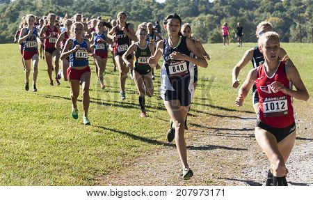 Wappingers falls New York USA - 23 September 2017: The lead pack of the varsity high school girls cross country race at the Bowdoin Park Cross Country Invitational around 400 meters into the 5K race.