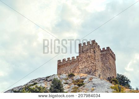 Genoese fortress in Sudak, the Crimea Peninsula, Black sea. Consular castle and the fortification wall of the upper tier. Part of the wall, Museum-reserve 
