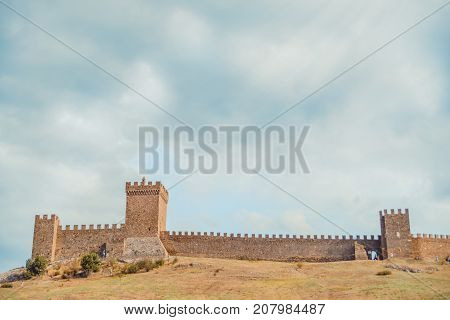 Genoese fortress in Sudak, the Crimea Peninsula, Black sea. Consular castle and the fortification wall of the upper tier. Part of the wall, Museum-reserve 