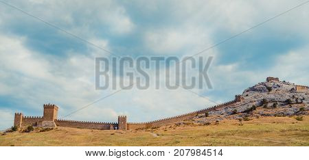 Genoese fortress in Sudak, the Crimea Peninsula, Black sea. Consular castle and the fortification wall of the upper tier. Part of the wall, Museum-reserve 