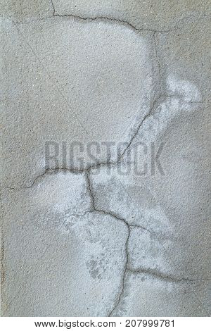 Closeup of cracked in concrete wall (concrete texture)