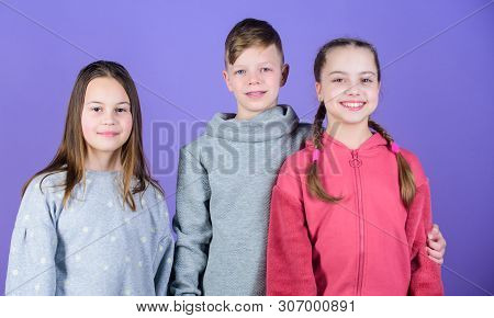 Girl And Boy True Friendship. Children Smiling Faces On Violet Background. Friends Hug. Childrens Da
