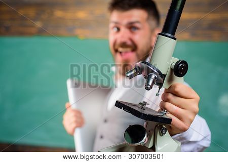 Happy Bearded Man In Science Class. E-learning. Biology Or Chemistry Concept. Scientist Or Docent Wi