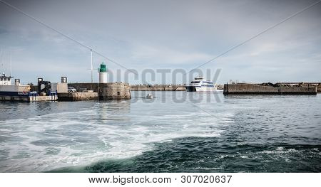Ferry That Enters The Harbor Of The Island Of Yeu, France