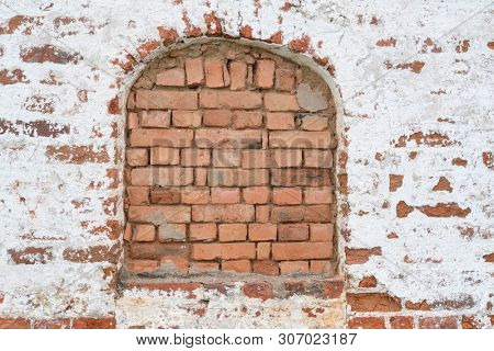 Background with the image of a brick wall with an immured window