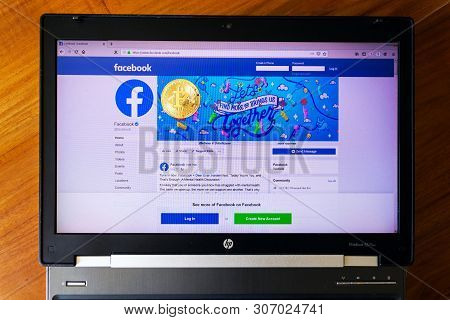 Prague, Czech Republic - June 18 2019: Golden Bitcoin Lying Homepage Of Facebook Launching Digital W