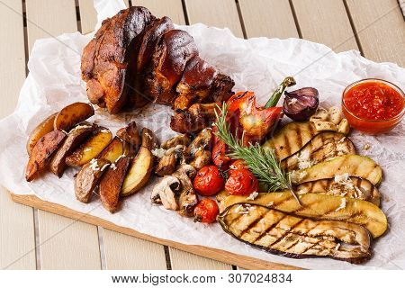 Grilled Pork Knuckle With Grilled Tomatoes, Champignons, Vagetable Marrow, Eggplant, Red Sweet Peppe