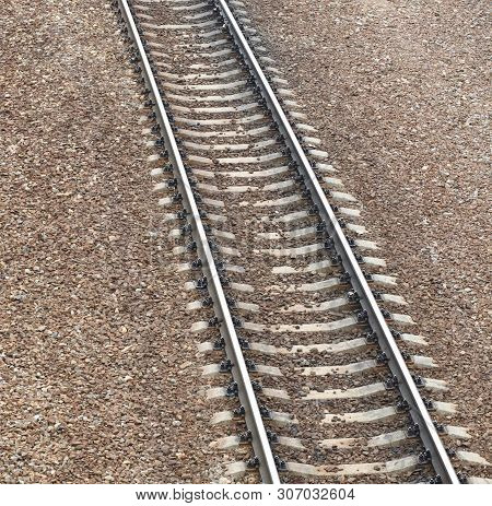 Railway At Day On Gravel Background At Dry Sunny Summer Day