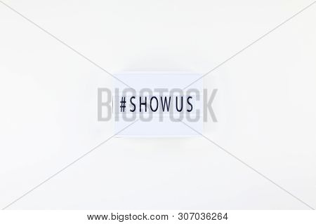 Creative Top View Flat Lay Of Lightbox With Hashtag Show Us Message White Background Minimal Style. 