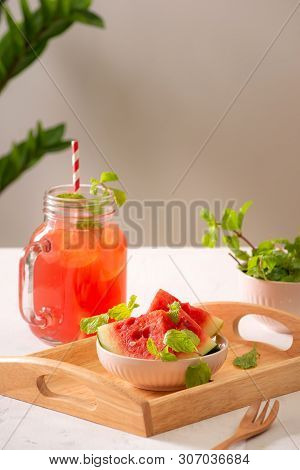 Watermelon Drink In Glass With Slices Of Watermelon On Whitebackground