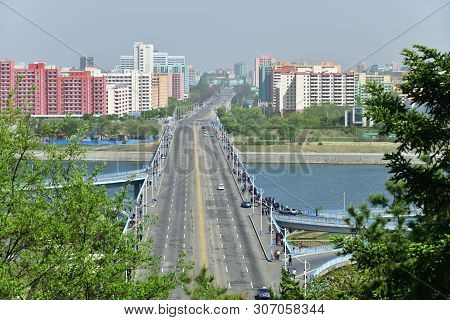 Pyongyang, North Korea - May 1, 2019: View From Above On The Bridge Over Taedong River And New Resid