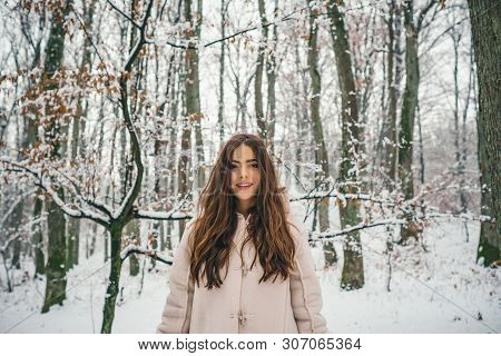 Beauty Winter Girl In Frosty Winter Park. Winter Woman Fan. Winter Woman Snow. Outdoors
