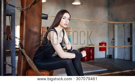 Girl Athlete Preparing For Training, Young Woman In Sportswear In The Boxing Ring
