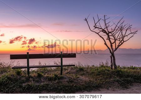 Bench On Cliff With Sunset Sea View In Peroulades. Corfu Island. Greece.
