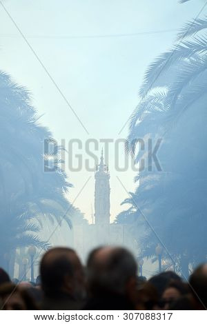 Crowd Looking At The Fireworks In Alicante With People Take Pictures