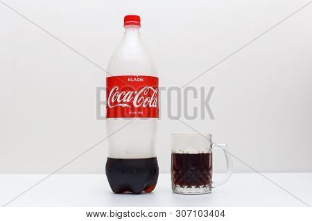 Labuan,malaysia-june 19,2019:plastic Bottle And Glass Half Full Of Original Coca Cola In Labuan,mala