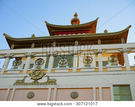 Fragment Of A Buddhist Temple On The Background Of A Blue Neba At Sunset