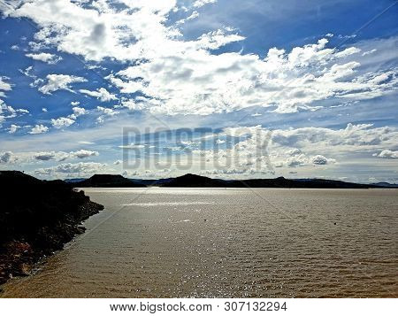 Cold, Wintery Water Photographed At Gariepdam, South Africa, White Clouds Against Briljant Blue Sky