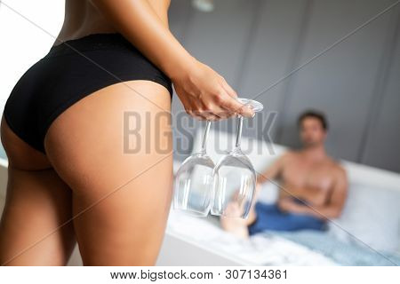 Attractive Sexy Woman With Her Partner In Bedroom