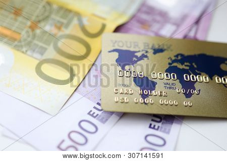 Gold Plastic Credit Rard With Euro Cash Lie On The Table. Cryptocurrency Exchage Concept.