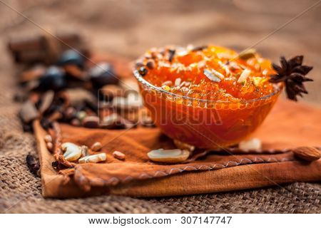 Famous Mango Preservation I.e. Murba Or Murabba In A Glass Bowl On Jute Bags Surface Along With Dry