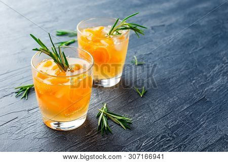 Summer Drinks, Rosemary Aprcot Cocktails With Ice In Glasses. Refreshing Summer Homemade Alcoholic O