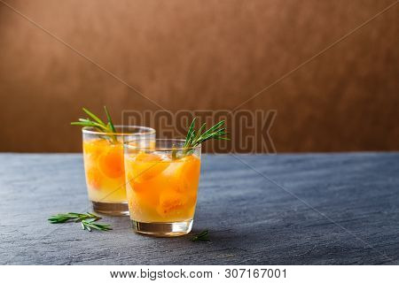 Summer Drinks, Rosemary Aprcot Cocktails With Ice In Glasses. Refreshing Summer Homemade Alcoholic O