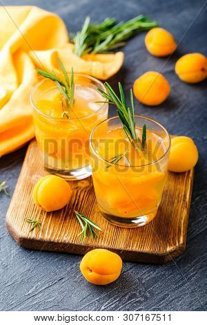Summer Drinks, Rosemary Aprcot Cocktails With Ice In Glasses. Refreshing Summer Homemade Alcoholic O