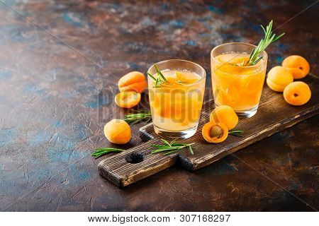 Summer Drinks, Rosemary Aprcot Cocktails With Ice In Glasses. Refreshing Summer Homemade Alcoholic O