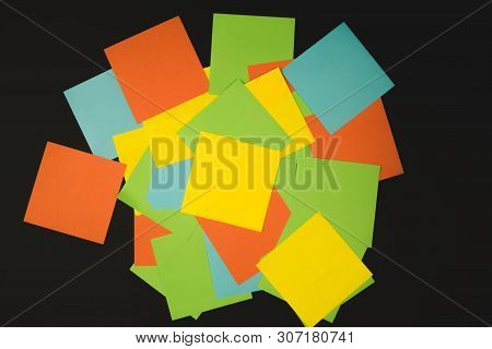 Different Color Paper Stickers With Pins Isolated On Black Background.